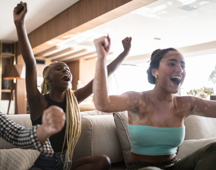 ESG manages and administers online and tv promotions and contests, like the one this group of friends is watching.