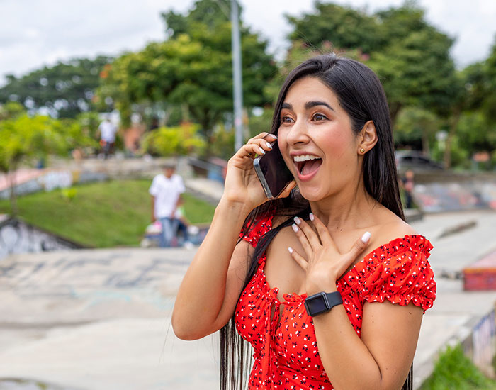 A woman on a telephone learns she's just won a contest